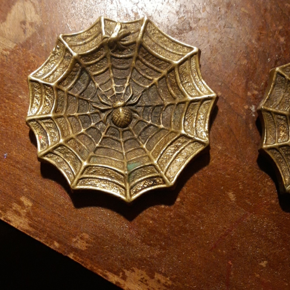 2 brass spiders webs